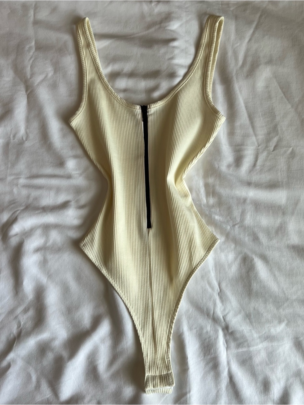 Naked Wardrobe Ribbed Scoop Neck Bodysuit in Cream with Front Zip